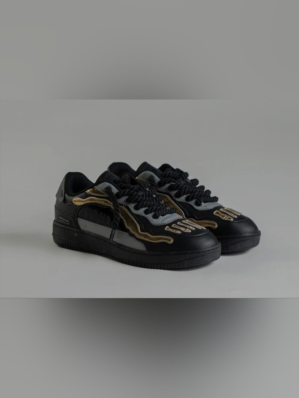 Black Sneakers with Gold Wave Accents